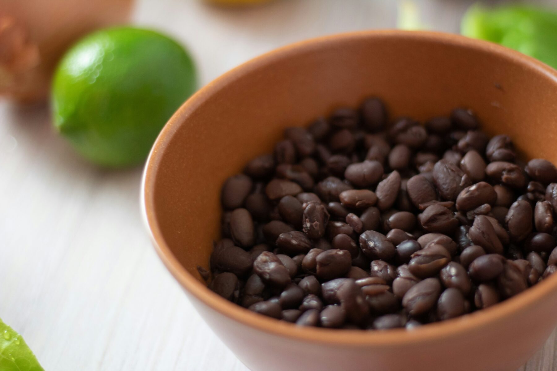 Cuban Black Bean Soup with Smoked Ham Hock is made with black beans simmered with smoked ham hocks and aromatic ingredients like onions, garlic, bell peppers, and spices. The infusion of flavors creates a deeply satisfying and robust soup.