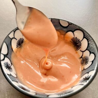 This homemade Yum Yum Sauce recipe delivers that creamy, tangy, and slightly sweet flavor perfect for dipping or drizzling over your favorite dishes. Whether you're enjoying sushi, shrimp, or vegetables, this delicious sauce adds a rich, zesty kick that will take your meal to the next level. Compared to spicy mayo, Yum Yum Sauce offers a milder, sweeter profile but with the same creamy texture that makes it a favorite at Japanese hibachi restaurants and sushi bars.