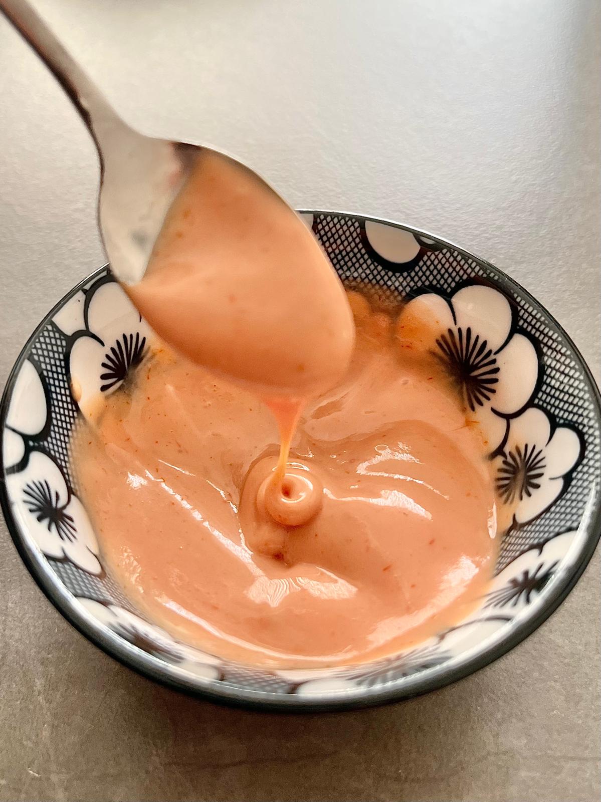 This homemade Yum Yum Sauce recipe delivers that creamy, tangy, and slightly sweet flavor perfect for dipping or drizzling over your favorite dishes. Whether you're enjoying sushi, shrimp, or vegetables, this delicious sauce adds a rich, zesty kick that will take your meal to the next level. Compared to spicy mayo, Yum Yum Sauce offers a milder, sweeter profile but with the same creamy texture that makes it a favorite at Japanese hibachi restaurants and sushi bars.