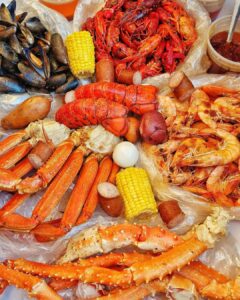 Learn how to make a delicious Angry Crab Shack-inspired seafood boil at home, featuring Cajun seasoning, Asian spices, and their signature Trifecta Sauce for a flavorful dining experience perfect for any occasion.