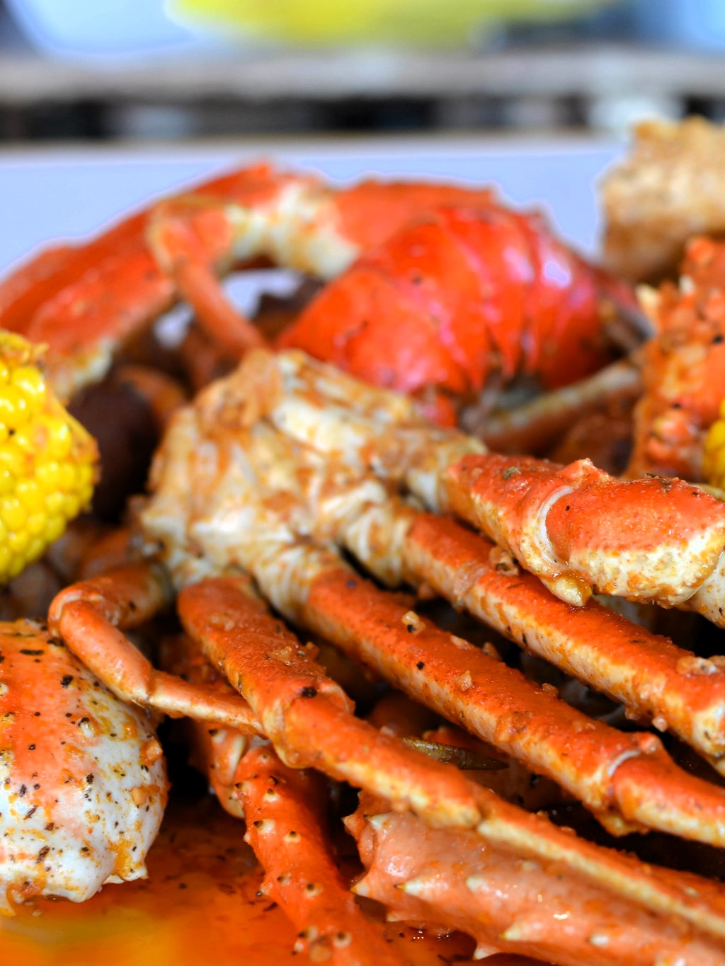 Learn how to make a delicious Angry Crab Shack-inspired seafood boil at home, featuring Cajun seasoning, Asian spices, and their signature Trifecta Sauce for a flavorful dining experience perfect for any occasion.