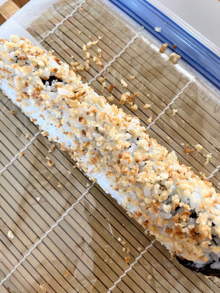 Learn how to make a delicious California Crunchy Sushi Roll at home with crispy panko breadcrumbs, creamy avocado, cucumber, and imitation crab for a fun and flavorful sushi experience.