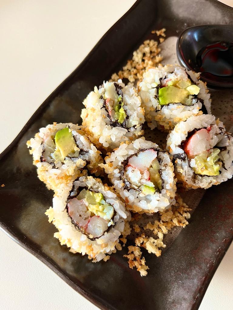 Learn how to make a delicious California Crunchy Sushi Roll at home with crispy panko breadcrumbs, creamy avocado, cucumber, and imitation crab for a fun and flavorful sushi experience.