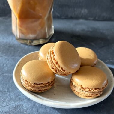 This easy coffee macaron recipe with espresso buttercream is perfect for coffee lovers, combining a rich coffee flavor with the delicate texture of French macarons.