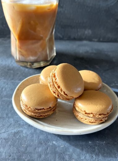 This easy coffee macaron recipe with espresso buttercream is perfect for coffee lovers, combining a rich coffee flavor with the delicate texture of French macarons.