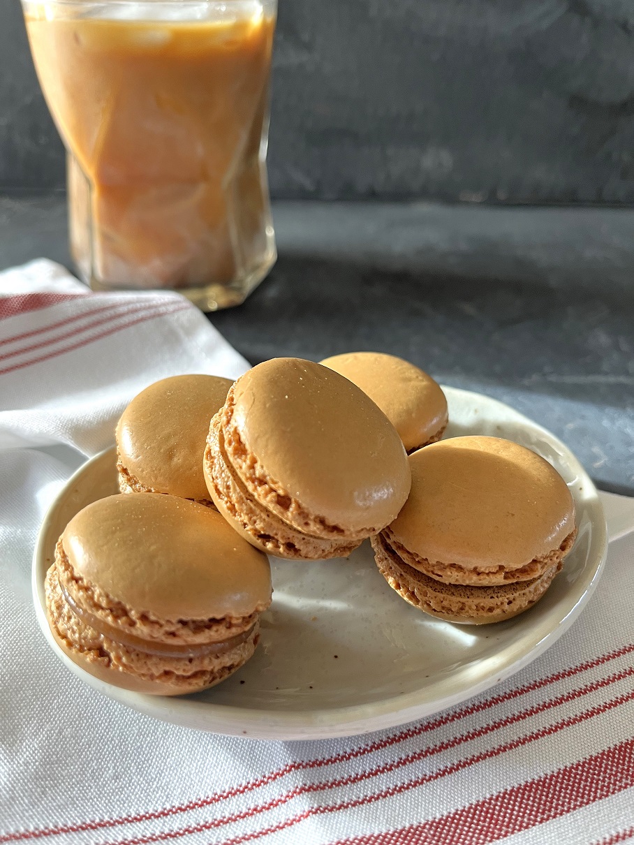 This easy coffee macaron recipe with espresso buttercream is perfect for coffee lovers, combining a rich coffee flavor with the delicate texture of French macarons.