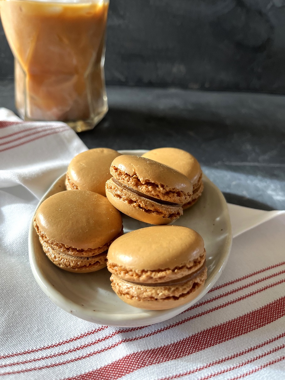 This easy coffee macaron recipe with espresso buttercream is perfect for coffee lovers, combining a rich coffee flavor with the delicate texture of French macarons.