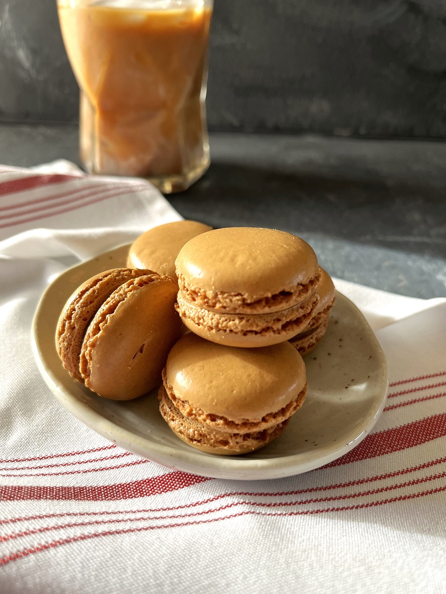 This easy coffee macaron recipe with espresso buttercream is perfect for coffee lovers, combining a rich coffee flavor with the delicate texture of French macarons.