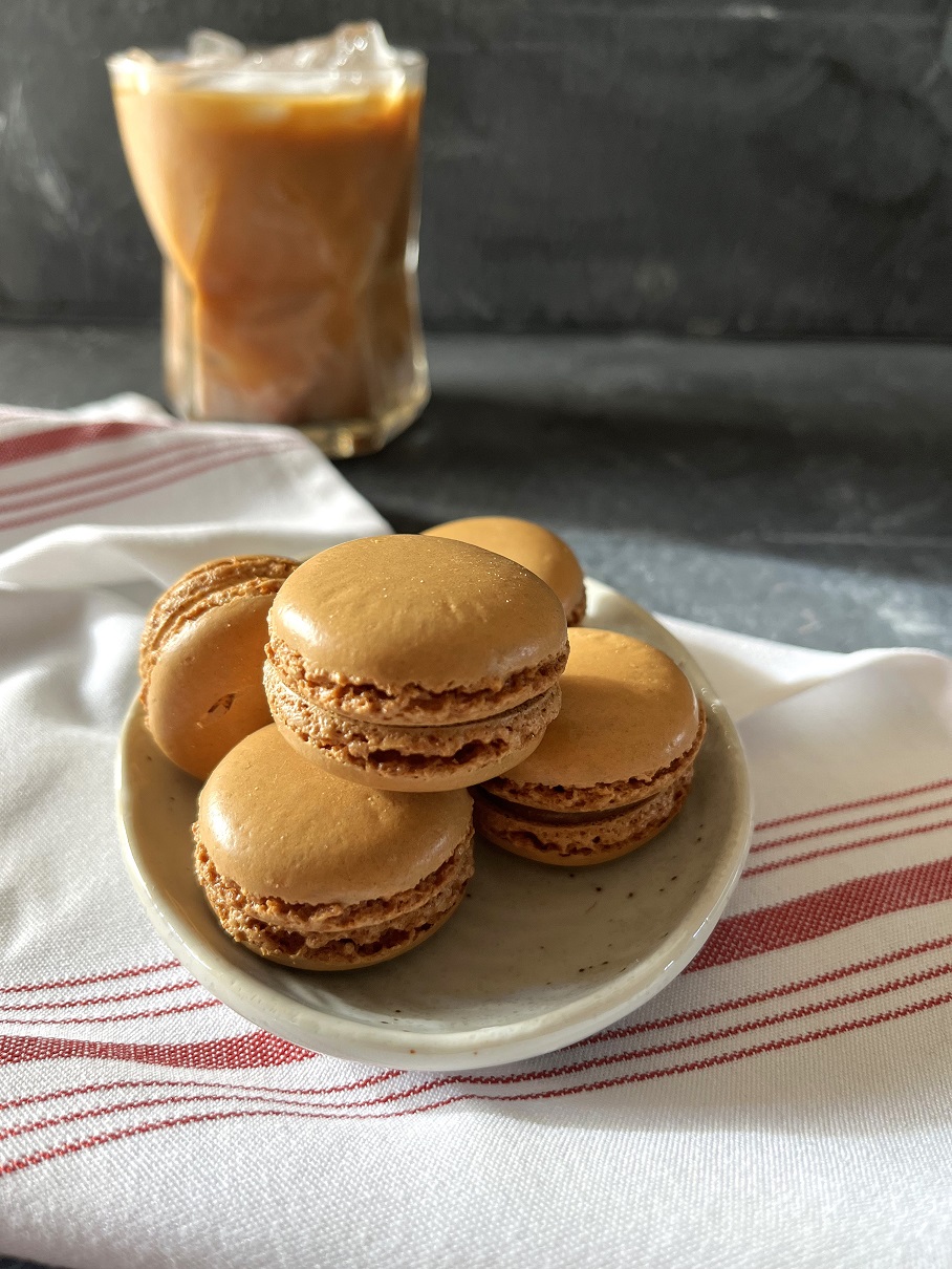 This easy coffee macaron recipe with espresso buttercream is perfect for coffee lovers, combining a rich coffee flavor with the delicate texture of French macarons.