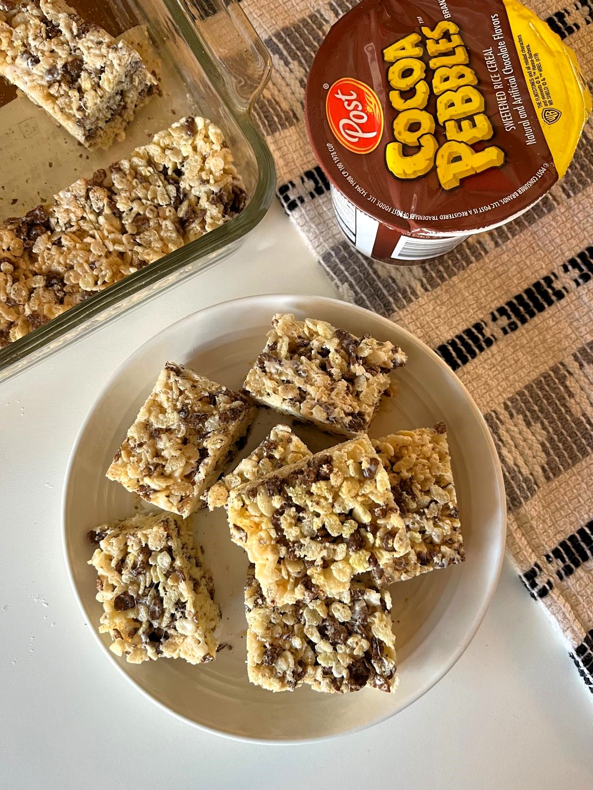 Cocoa Pebbles Rice Krispie Treats is a fun twist on a classic snack that both kids and adults will love. Try switching it up with Fruity Pebbles for a yummy rainbow colored treat!