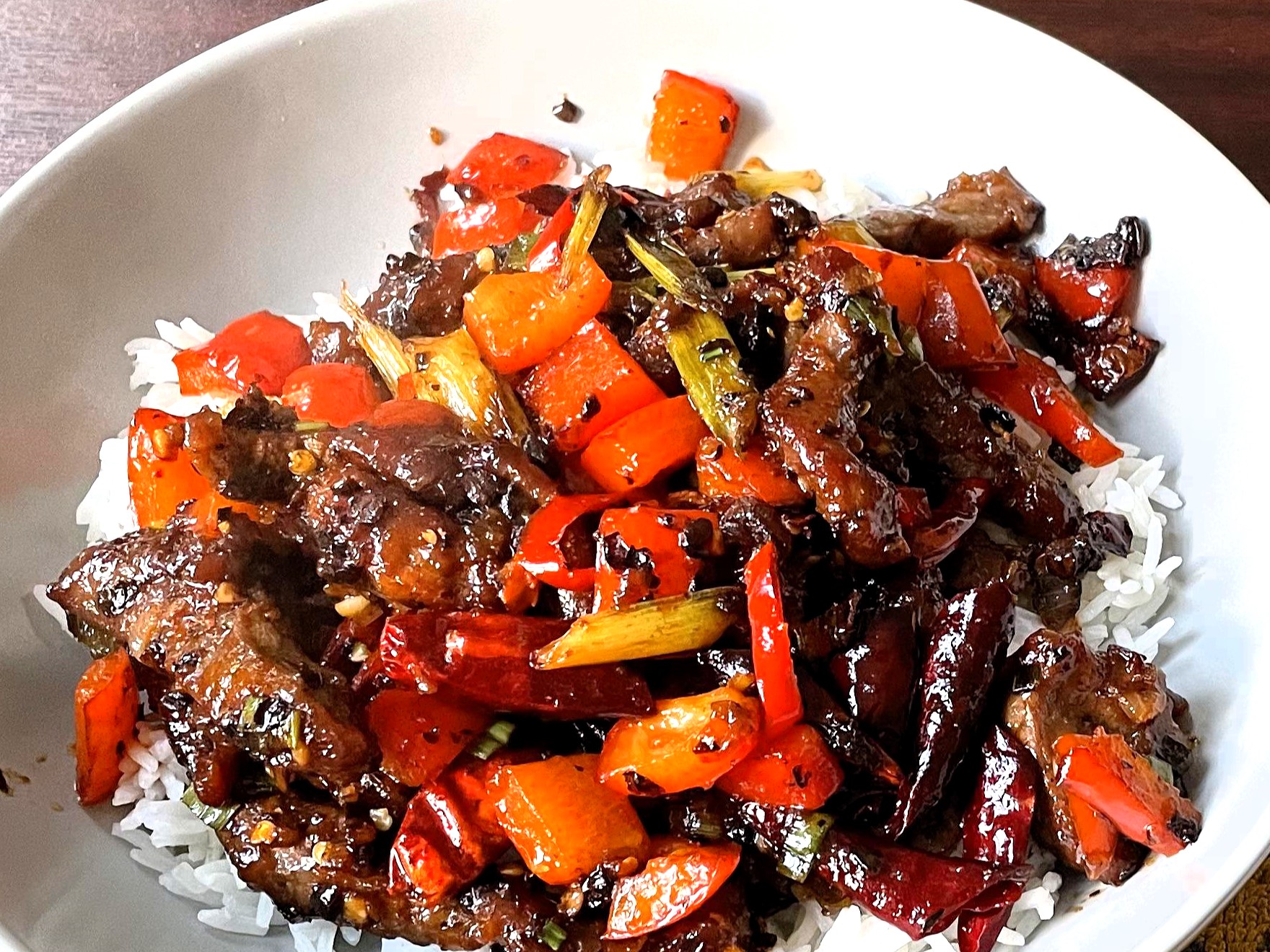 Learn about unique flavor profiles, origins, and key ingredients of Hunan Beef and Mongolian Beef, and how to make Hunan Beef recipe with soy sauce, chili paste, hoisin sauce, and more!