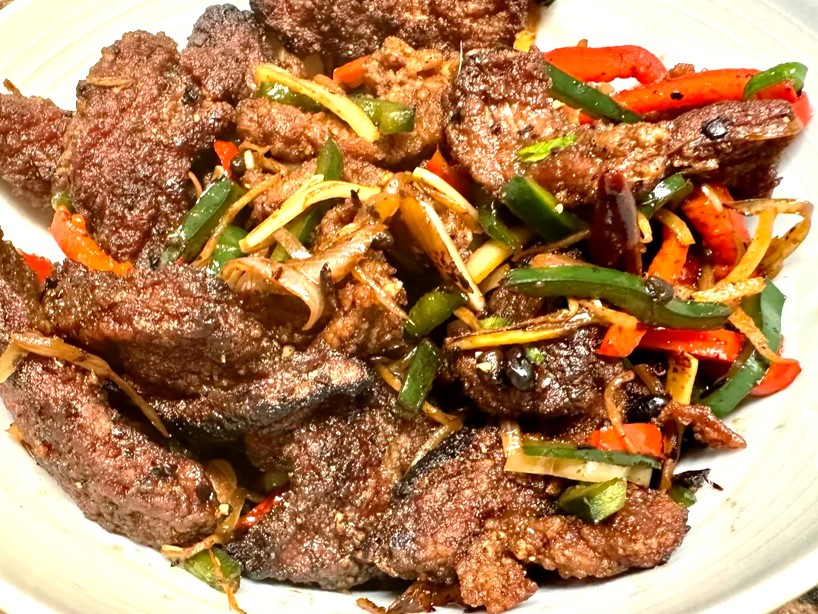 Learn about unique flavor profiles, origins, and key ingredients of Hunan Beef and Mongolian Beef, and how to make Hunan Beef recipe with soy sauce, chili paste, hoisin sauce, and more!