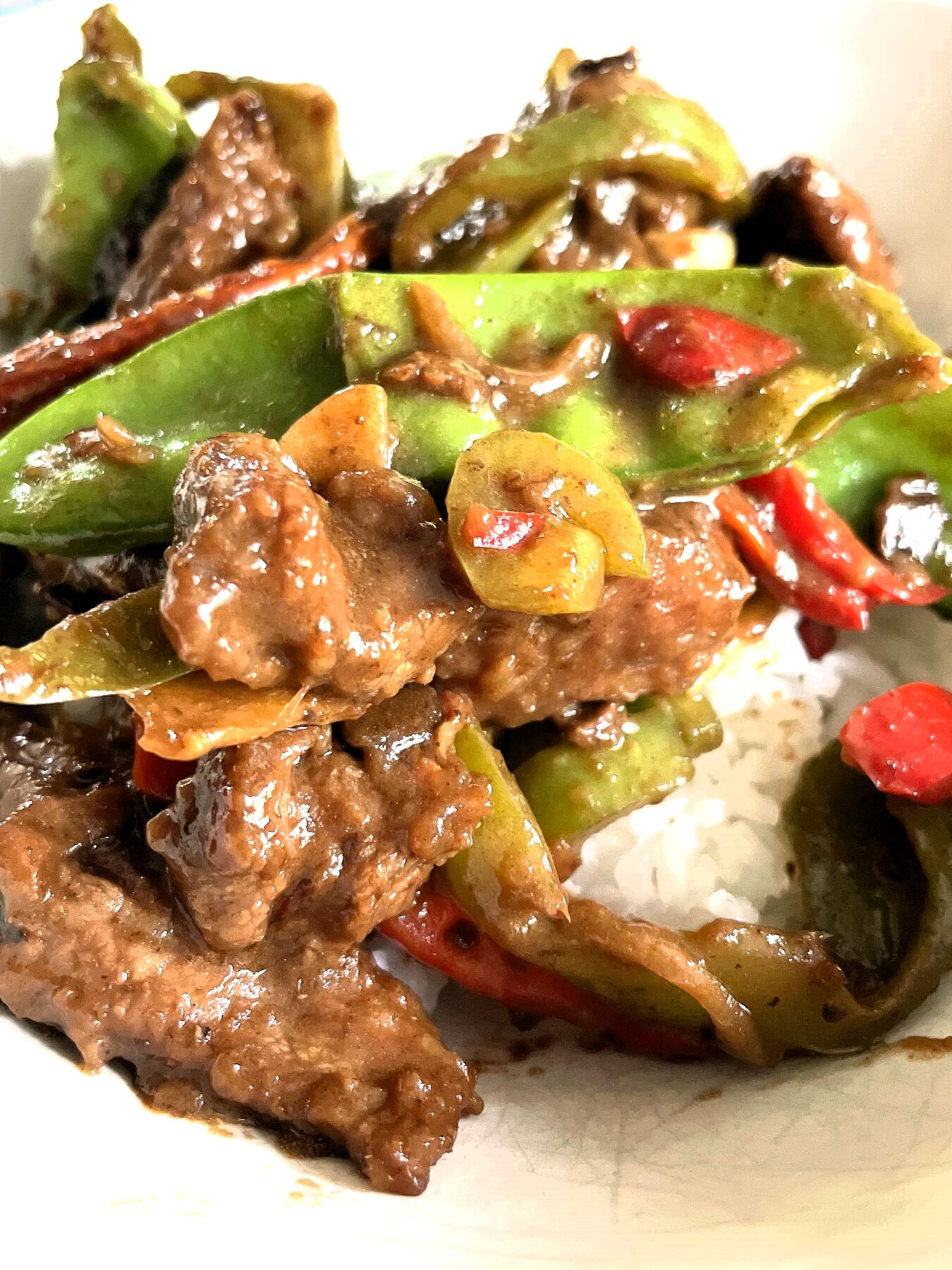 Learn about unique flavor profiles, origins, and key ingredients of Hunan Beef and Mongolian Beef, and how to make Hunan Beef recipe with soy sauce, chili paste, hoisin sauce, and more!