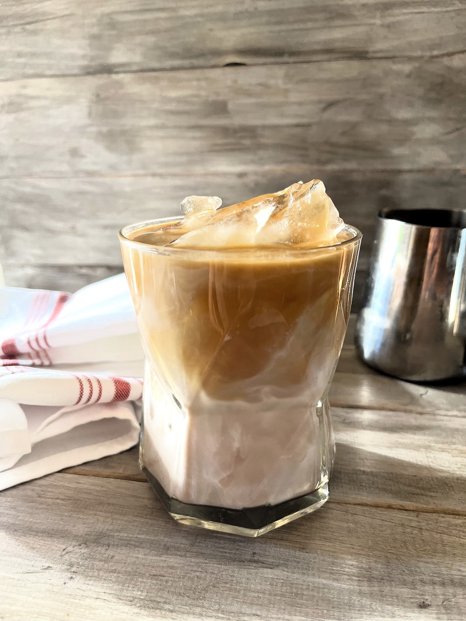 This Iced Caramel Macchiato Upside Down Coffee served upside down is the perfect blend of sweet vanilla, rich espresso, poured in first, followed by the creamy milk, resulting in a smoother, more integrated flavor profile.