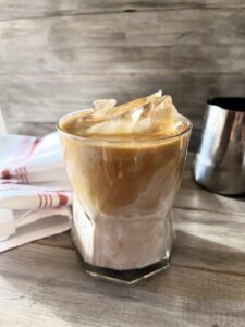 This Iced Caramel Macchiato Upside Down Coffee served upside down is the perfect blend of sweet vanilla, rich espresso, poured in first, followed by the creamy milk, resulting in a smoother, more integrated flavor profile.