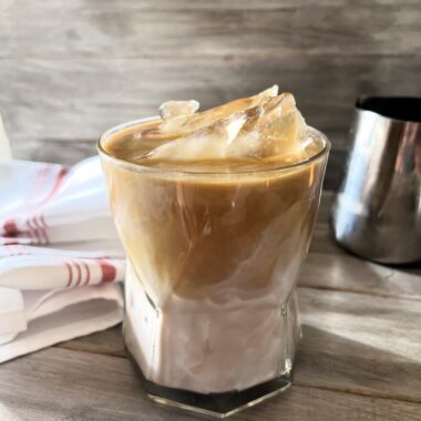 This Iced Caramel Macchiato Upside Down Coffee served upside down is the perfect blend of sweet vanilla, rich espresso, poured in first, followed by the creamy milk, resulting in a smoother, more integrated flavor profile.