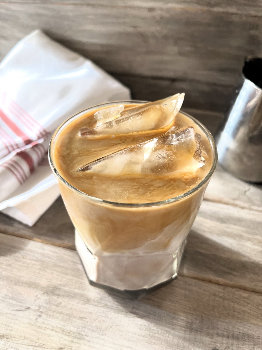 This Iced Caramel Macchiato Upside Down Coffee served upside down is the perfect blend of sweet vanilla, rich espresso, poured in first, followed by the creamy milk, resulting in a smoother, more integrated flavor profile.