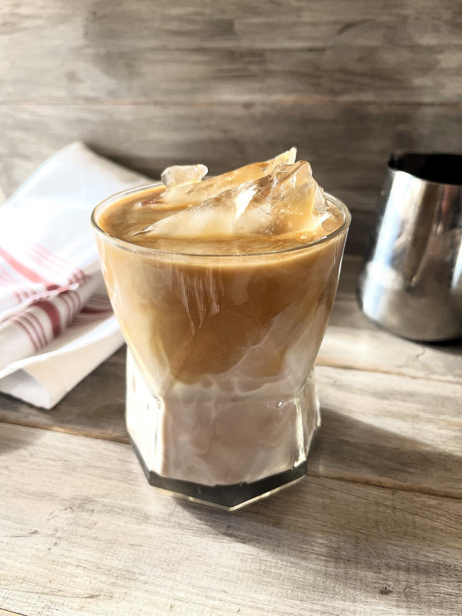 This Iced Caramel Macchiato Upside Down Coffee served upside down is the perfect blend of sweet vanilla, rich espresso, poured in first, followed by the creamy milk, resulting in a smoother, more integrated flavor profile.